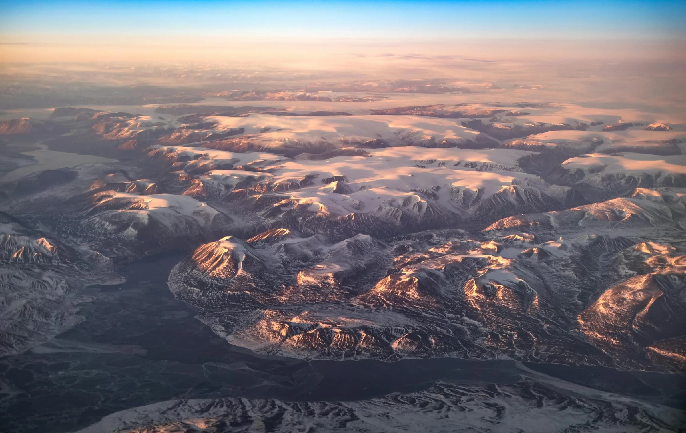 Snowy Greenland landscape at sunset