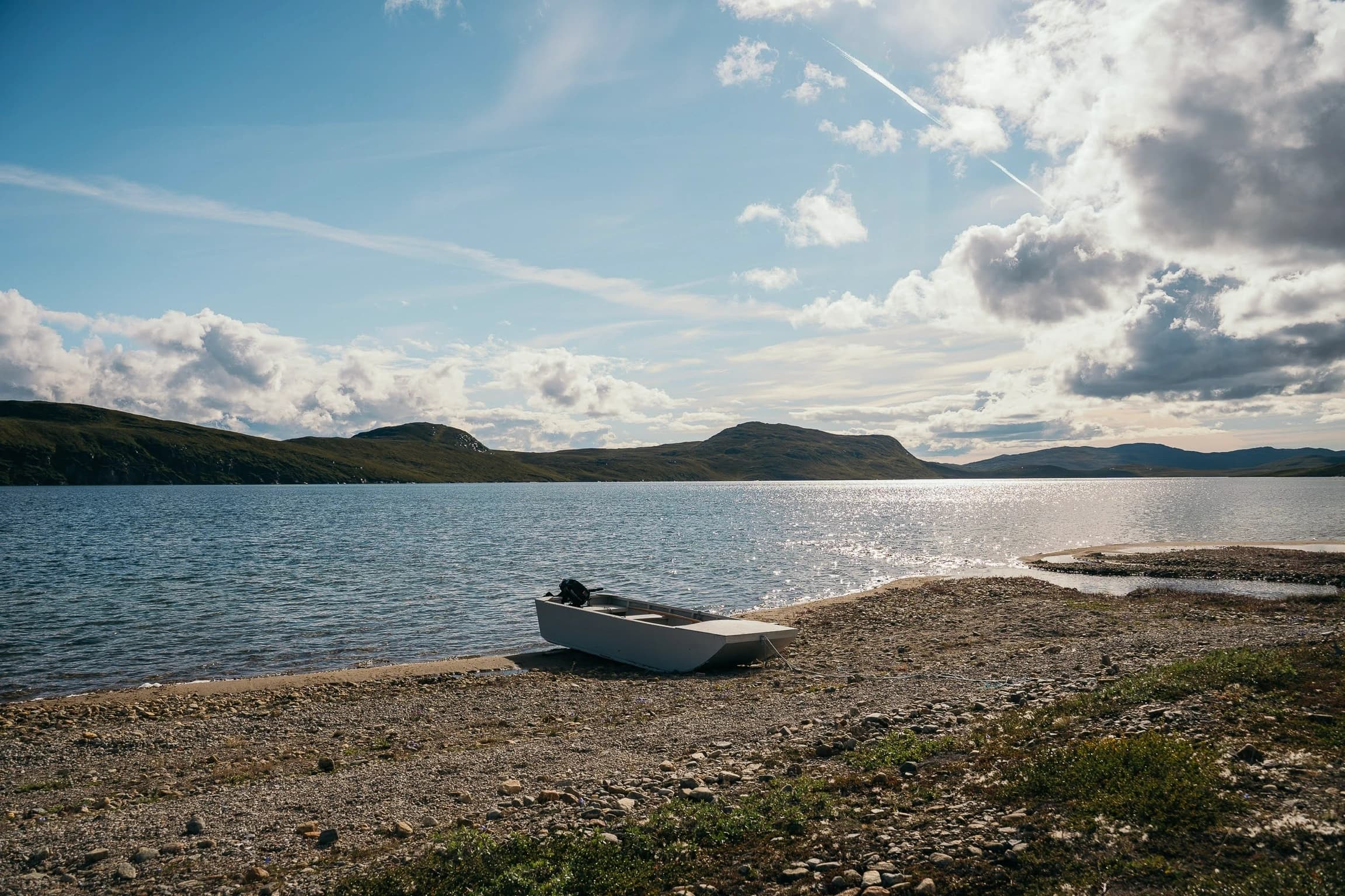 The skiff, pulled up on the sand