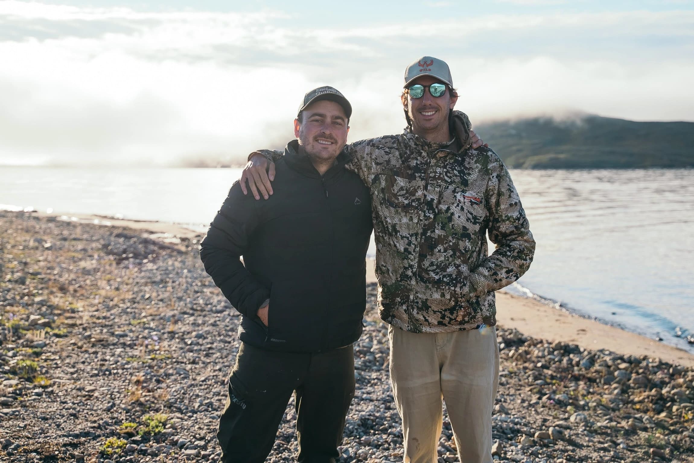 Hunters on the shore of the fjord